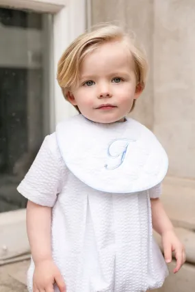 Boys White Seersucker Quilted Bib Trimmed With Blue